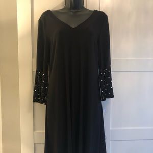 Little black dress with embellished sleeves